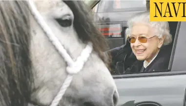  ?? CHRIS JACKSON/GETTY IMAGE ?? Queen Elizabeth, in sunglasses and bright pink lipstick, watches the horses from her Range Rover at
the Royal Windsor Horse Show in Windsor, England, on Friday. The event is said to be her favourite.