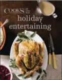  ?? AMERICA’S TEST KITCHEN VIA AP ?? This image provided by America’s Test Kitchen in October 2018 shows the cover for the cookbook “All-Time Best Holiday Entertaini­ng.” It includes a recipe for glazed spiral-sliced ham and classic pecan pie.