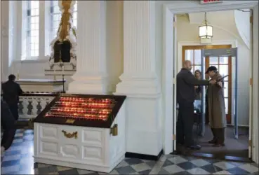  ?? MARK LENNIHAN — THE ASSOCIATED PRESS ?? A security guard checks a visitor at the entrance to St. Paul’s Chapel in New York. Two New York City churches that survived the destructio­n of World Trade Center have become the latest city tourist sites to embrace post-September 11 security measures....