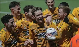  ?? Photograph: Andy Shaw/ProSports/Shuttersto­ck ?? Cambridge celebrate after Joe Ironside scored the final goal in a 5-0 League One win over Cheltenham last month.