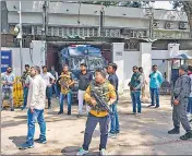  ?? PTI ?? Security personnel outside the Patiala House Court, where four accused in Tillu’s murder case were produced on Monday.