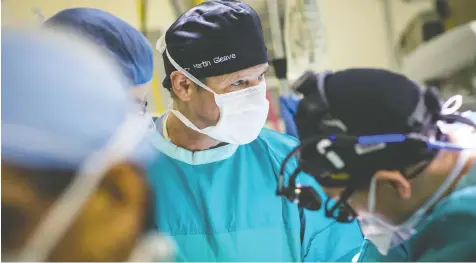  ?? — POSTMEDIA FILES ?? Cancelled surgeries due to the COVID-19 crisis have added thousands of patients to the already lengthy wait list for procedures in B.C. Here, Dr. Martin Gleave operates on a patient at Vancouver General in 2018.