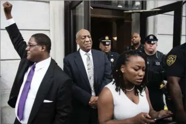  ?? MATT ROURKE — ASSOICATED PRESS ?? Bill Cosby listens to his wife Camille’s statement being read aloud by Ebonee M. Benson outside the Montgomery County Courthouse after a mistrial in his sexual assault case in Norristown, Pa., Saturday, June 17, 2017. Cosby’s trial ended without a...