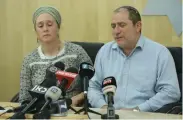  ?? (Marc Israel Sellem/The Jerusalem Post) ?? TERROR VICTIM Shira Ish-ran’s parents, Liora and Chaim Silberstei­n, update reporters on their daughter’s condition.