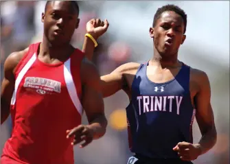  ?? Katharine Lotze/Special to The Signal (See additional photos on signalscv.com) ?? Trinity Classical Academy’s Solomon Strader celebrates a state-qualifying finish in the 200-meter dash at the CIF-Southern Section Masters Meet at El Camino College in Torrance on Saturday.