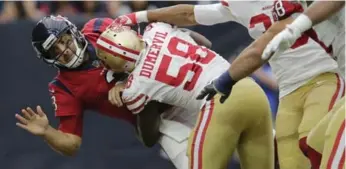  ?? TIM WARNER/GETTY IMAGES FILE PHOTO ?? Texans QB Tom Savage returned to action after a hard hit by Elvis Dumervil despite showing signs of a concussion.