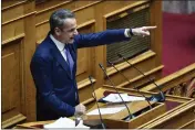  ?? MICHAEL VARAKLAS — THE ASSOCIATED PRESS ?? Greece's Prime Minister Kyriakos Mitsotakis speaks during a debate in parliament Thursday on same-sex marriage in Athens, Greece.