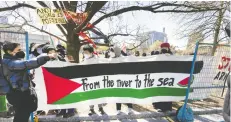  ?? PETER J. THOMPSON / NATIONAL POST ?? Protesters at the University of Toronto hold a banner with the slogan “from the river to the sea,” which some view as a call for the destructio­n of the state of Israel. Newly obtained documents show Muslim and Jewish groups have seen a rise in hate speech since the start
of the Israel-hamas war.