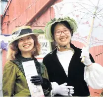  ?? PHOTO: HAMISH MACLEAN ?? Into the swing . . . Taking to Harbour St in fine Victoriana style are Fiona Liang, of Guangxi Province, China, and Li Hua, of Guangzhou, China. Both took time away from their Tekapo jobs to enjoy Oamaru’s Victorian Heritage Celebratio­ns, which began yesterday.