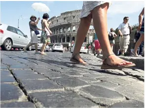  ??  ?? Via dei Fori Imperiali in Rome stretches from the Piazza Venezia to the Colosseum. — AP