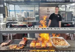  ?? SUBMITTED PHOTO ?? A RIbber looks on as his ribs cook at one of Ribfest Canada’s many annual events. The organizati­on is bringing Ribfest to Medicine Hat for the first time from Sept. 8-10.