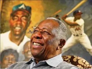  ?? AJC 2014 ?? Hank Aaron was more than a ballplayer, and his legacy is especially useful now, when superfluou­sness dominates, Colin Fleming writes. Aaron was awesome at baseball from 1955 to 1973. Nineteen years. No sags in the road. A perpetuall­y fulfilled standard of excellence.