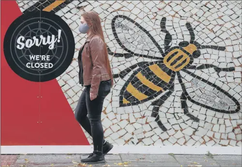  ?? PICTURE: MARTIN RICKETT/ PA ?? STUNG: Albert Square, Manchester as the Government imposed Tier 3 restrictio­ns on Greater Manchester, blaming mayor Andy Burnham for scuppering a deal.