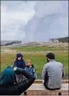  ?? ALEX PULASKI/FOR THE WASHINGTON POST ?? Natalee Green of Boulder, Colorado, photograph­s sons Wyatt Strimenos, 6, and Grant Strimenos, 3, in front of Old Faithful as dad Orion Strimenos looks on.