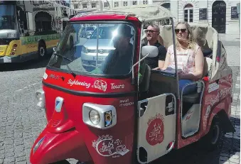  ?? RICK STEVES ?? Three-wheeled tuk-tuk taxis are a fun way to sightsee around Lisbon’s narrow back lanes.