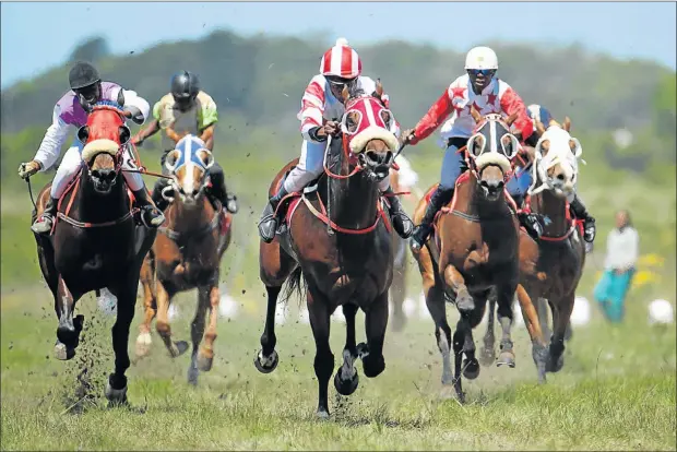  ?? Picture: MARK ANDREWS ?? HOMEWARD BOUND: Riders charging down the home-straight during one of the races at a previous Berlin November event