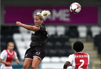  ??  ?? Katrina Parrock rises above Ajax defender Liza van der Most.