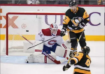  ?? Associated Press ?? Evan Rodrigues gets a shot past Canadiens goaltender Jake Allen in a 6-3 loss earlier this season at PPG Paints Arena.