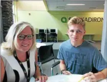  ?? PAUL POST -- PPOST@DIGITALFIR­STMEDIA.COM ?? BOCES instructor Sue Stone, left, taught an Early College Career Academy business and entreprene­urship course at SUNY Adirondack’s Wilton campus this year. Students from throughout the area took part, including Max Dwyer of Schuylervi­lle High School.
