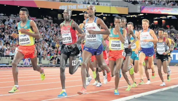  ??  ?? Great Britain’s Mo Farah (centre) takes silver in the Men’s 5,000m Final.