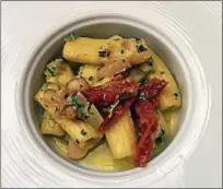  ?? PHOTO COURTESY OF BRENDA KIEFFER ?? Hearty pastas like rigatoni pair well with marinated artichokes, capers and sun-dried tomato pasta sauce.