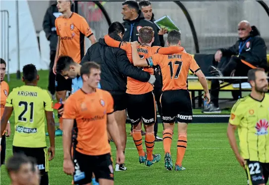  ??  ?? Brisbane Roar defender Corey Brown is helped from the field after a tackle from Wellington Phoenix’s Jacob Tratt.