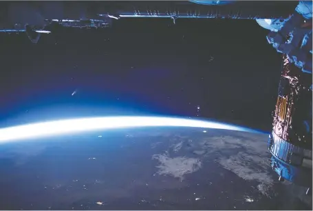  ?? NASA, ISS ?? Comet NEOWISE (look for object with tail midfield and to centre-left) has been growing brighter in the pre-dawn skies but will only be round for another 10 days or so before it heads back across the galaxy. This photo was taken from the Internatio­nal Space Station last week.