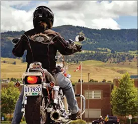  ?? Special to The Daily Courier ?? A rider pauses in the Rutland Secondary school parking lot before performing a manoeuvre at a KDSC course.