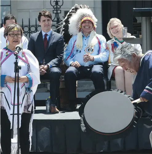  ?? SEAN KILPATRICK / THE CANADIAN PRESS ?? Prime Minister Justin Trudeau and Perry Bellegarde, national chief of the Assembly of First Nations, watch an Inuk couple perform during National Aboriginal Day, renamed National Indigenous Peoples Day, in Ottawa on June 21.