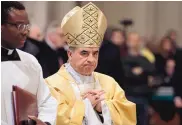  ?? GREGORIO BORGIA/ASSOCIATED PRESS ?? Mons. Giovanni Angelo Becciu presides over an eucharisti­c liturgy, at the St. John in Latheran Basilica, in Rome in 2017.