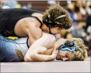  ?? NATE HECKENBERG­ER - FOR MEDIANEWS GROUP ?? Coatesvill­e’s Jack Weldon works on top against Unionville’s Ryan O’Leary in a 12-2win in the 172-pound final Saturday.
