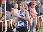  ?? Jeremy Stewart / Rome News-Tribune ?? Model’s Alex Quarles crosses the finish line in the girls’ varsity race of the 25th annual Ridge Ferry Invitation­al.