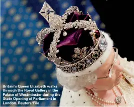  ??  ?? Britain's Queen Elizabeth walks through the Royal Gallery in the Palace of Westminste­r during the State Opening of Parliament in London. Reuters/File