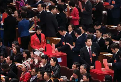  ?? AP/ANDY WONG ?? Delegates line up to cast their votes Saturday in the presidenti­al election during a session of China’s National People’s Congress in Beijing.