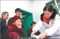  ?? CHEN SHICHUAN / FOR CHINA DAILY ?? A nurse at a public clinic in Chongqing gives a senior a free health checkup. About 4,600 people over 65 are expected to enjoy the benefits of the team by mid-April.