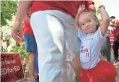  ??  ?? Glendale teacher Sheri Kisselbach and her granddaugh­ter, Teigen, 2, of Casa Grande, attend the Invest In Education campaign press conference at the Capitol in Phoenix on Thursday, the deadline for turning in signatures.