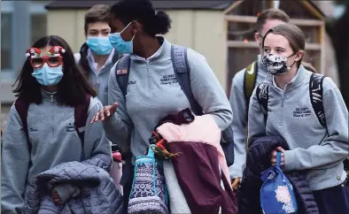  ?? Erik Trautmann / Hearst Connecticu­t Media ?? Students leave All Saints Catholic School Wednesday in Norwalk.