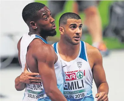  ?? Picture: Getty Images. ?? Adam Gemili congratula­tes Nethaneel MitchellBl­ake on winning silver in the 200m final.