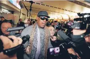  ?? Photo: REUTERS ?? FormerNBAb­asketball player Dennis Rodman speaks to the media after returning from his trip to North Korea at Beijing airport. Sponsorshi­p for the visits has been withdrawn.