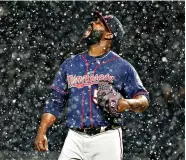  ?? AP Photo/ Gene J. Puskar ?? ■ Minnesota Twins relief pitcher Fernando Rodney stands on the mound during a snow squall in the ninth inning of the team’s baseball game against the Pittsburgh Pirates on Wednesday in Pittsburgh. The Twins won, 7-3.