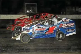  ?? RICK KEPNER — FOR DIGITAL FIRST MEDIA ?? Craig VonDohren (1C) and Jeff Strunk (126) battle for positionin­g during Saturday night’s Freedom 76 Modified Classic at Grandview.