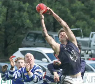  ??  ?? Catani player Brandon Scammell stretches but can’t pull in the mark during the preliminar­y final at Longwarry; Photograph: Michael Robinson.