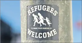  ?? (Photo: John O’Connell) ?? ‘Refugees Welcome - Bring Your Families’: A sticker pictured on a lamp post in Fermoy. It is understood that this sticker, along with several others appeared on lamp posts across the town in 2019. Several have since been removed. However, one remains with its message remaining strong amidst the ongoing war in Ukraine.