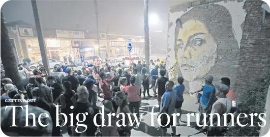  ?? Photograph­s by Lawrence K. Ho
Los Angeles Times ?? BLACKLISTL­A FOUNDER Erik Valiente, at top right, talks to the group before a run, which on this night meets in Venice for a look at its murals, above.