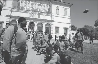  ?? THE ASSOCIATED PRESS ?? Michigan football players gather in Rome’s Villa Borghese park on Sunday. The team arrived in Italy this weekend.