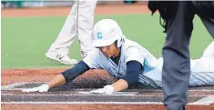  ?? JIM THOMPSON/JURNAL ?? Cleveland’s Ryan Maiez slides across the plate to give the Storm a 2-0 lead over Hobbs on Friday.