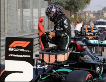  ?? AP Photo/Luca Bruno, Pool ?? Mercedes driver Lewis Hamilton of Britain steps out of his car after clocking the second fastest time during qualificat­ion ahead of Sunday’s Emilia Romagna Formula One Grand Prix, at the Enzo and Dino Ferrari racetrack, in Imola, Italy, on Saturday.