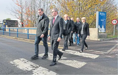  ?? Picture: PA. ?? Economy Minister Derek Mackay, front right, during a visit to Michelin’s Dundee tyre factory.