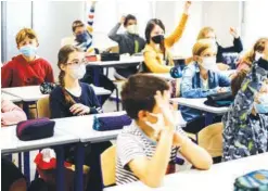  ?? AP PHOTO/JEAN-FRANçOIS BADIAS ?? Children sit in a classroom at school in Strasbourg, eastern France on Thursday. Children across Europe are going back to school.