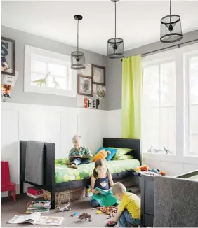  ?? COUNTRY LIVING, MAX KIM-BEE/The Associated Press ?? In this boy’s room, shared by a five-year-old and a two-year-old, bright-green window panelsamp up the energy and grey walls with pops of colour make it fun.